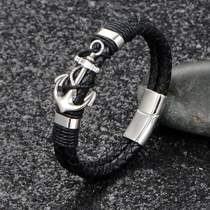 Retro nautical braided black leather bracelet featuring a polished silver anchor pendant
