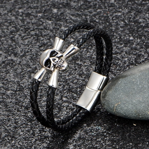 Men's double-layered black woven leather bracelet with stainless steel skull and magnetic clasp