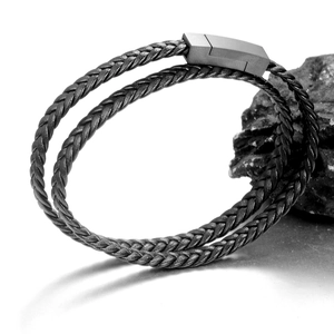 Men's double-wrap braided leather bracelet with matte grey magnetic metal clasp on stone