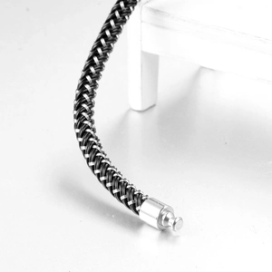 Men's braided stainless steel and black silicone bracelet with industrial metal clasp