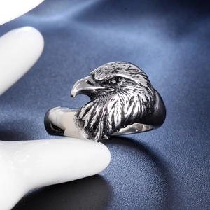 Men's retro stainless steel eagle ring featuring detailed feather textures on hand model