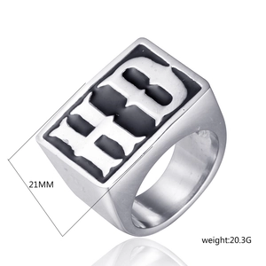 Macro detail of men's titanium ring featuring HB letters, 21mm width and 20.3g weight