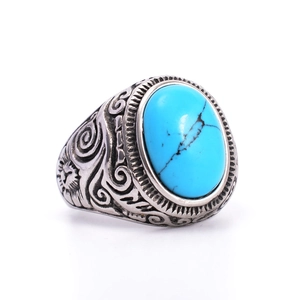 Vintage stainless steel ring for men featuring an oval turquoise stone and sun relief carving