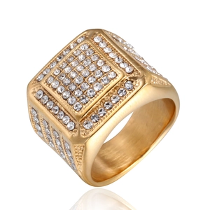 Macro shot of hip hop square gold ring with sparkling rhinestones and brushed inner band