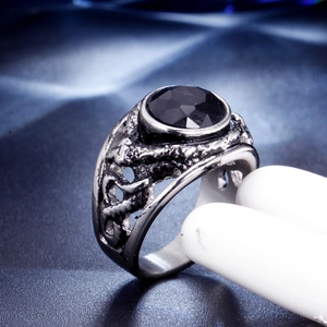 Vintage stainless steel ring featuring a large faceted black gemstone and carved details