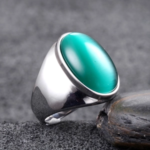 Polished silver titanium steel ring with a large oval green gemstone for men