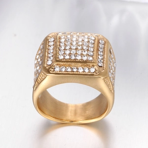 Detailed macro view of gold-plated square hip hop ring with rows of shimmering zircons