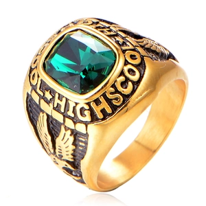 Detail of gold eagle ring with emerald green stone and High School engraving