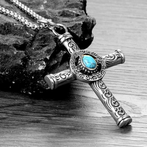 Vintage stainless steel cross necklace featuring a turquoise inlay and vine engravings