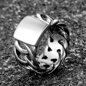 Macro shot of heavy chain link texture and smooth rectangle top on vintage steel ring