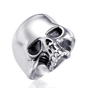 Detailed macro view of silver stainless steel skull ring with gothic punk head engraving