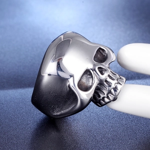 Macro side view of stainless steel skull ring showing gothic bone texture and details