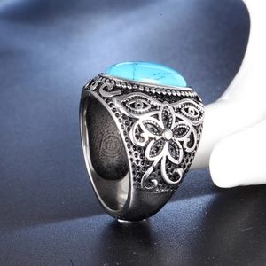 Vintage stainless steel ring with blue turquoise stone and floral engraved patterns