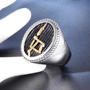 Retro titanium steel signet ring with golden relief symbol and black textured finish