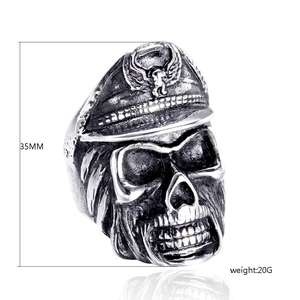 Macro view of a 35mm punk skull ring with officer hat and eagle relief detail
