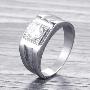 Macro shot of silver stainless steel ring for men with square-cut center crystal