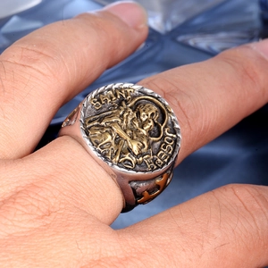 Macro shot of vintage Saint Joseph relief ring in two-tone stainless steel finish