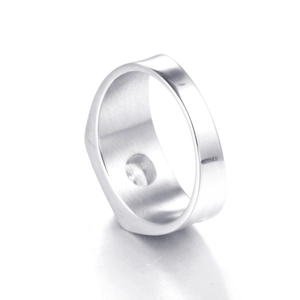 Macro shot of silver stainless steel wedding ring featuring a recessed flat design for men
