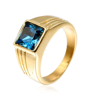 Detail of square-cut blue gemstone and golden grooved band on men's titanium ring