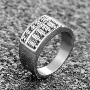 Detailed side view of gothic abacus ring showing precise beads and brushed metal finish