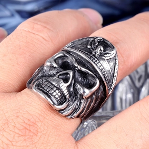Detailed macro view of a punk rock skull ring with an eagle emblem on a vintage helmet