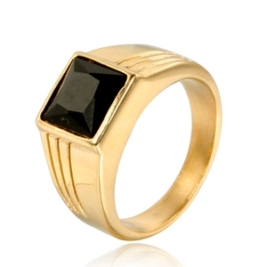 Detail of gold titanium ring with square black gemstone and side groove textures