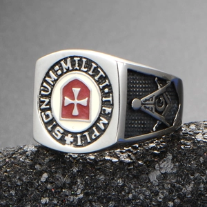 Macro shot of silver Knights Templar ring with SIGILLUM MILITUM TEMPLI engraving and red cross