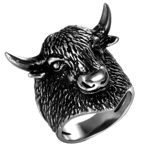 Macro detail of vintage stainless steel ram head ring showing intricate carved textures