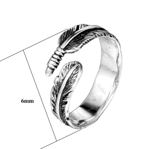 Close-up of 6mm wide vintage feather pattern on a stainless steel punk ring