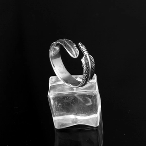 Detailed view of punk style stainless steel feather ring with vintage oxidized finish