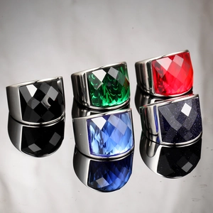 Detailed showcase of five multi-colored gemstone rings in polished titanium steel