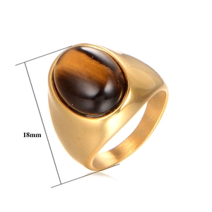 Detail view of 18mm tall gold men's signet ring with oval natural tiger eye stone inlay