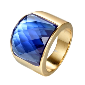 Vintage gold wide band ring with square multifaceted blue sapphire gemstone in a minimalist style