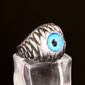 Gothic punk stainless steel ring with a blue eye design and silver skeleton structure