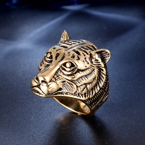 Detailed gold tiger head ring made of titanium steel with vintage black etching details