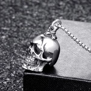 Vintage stainless steel skull pendant necklace with silver box chain on black display box