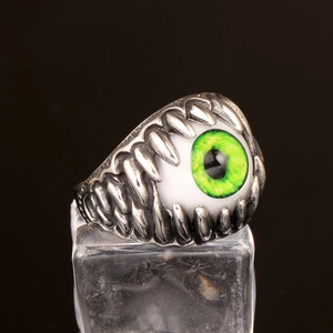Punk style stainless steel ring featuring a green dragon eye with silver claw setting