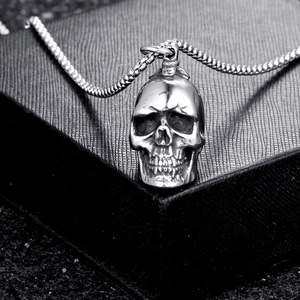 Vintage stainless steel skull pendant necklace with box chain on jewelry display box