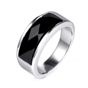 Polished wide band stainless steel ring featuring a faceted rectangular black gemstone