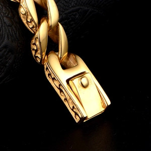 Vintage golden stainless steel Cuban chain bracelet with intricate engraved details