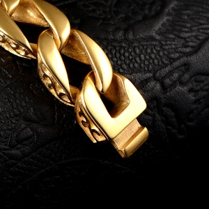 Vintage gold stainless steel curb bracelet for men featuring intricate hollow carvings