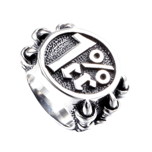 Macro detail of vintage 1%er stainless steel biker ring with eagle claw texture