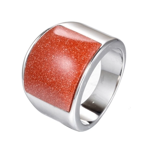 Detail of a wide stainless steel band featuring a rectangular brown goldstone inlay