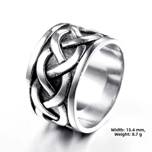 Macro view of wide vintage stainless steel ring featuring Celtic knot patterns, size 9