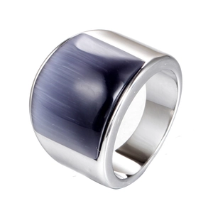 Macro shot of stainless steel wide ring featuring a rectangular grey-blue cat eye stone