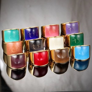 Detailed set of eleven gold-plated stainless steel rings with colorful square cabochon stones
