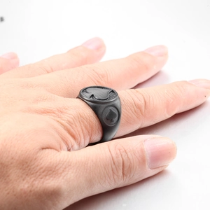 Macro shot of matte black spade ring for men featuring poker motifs and industrial finish
