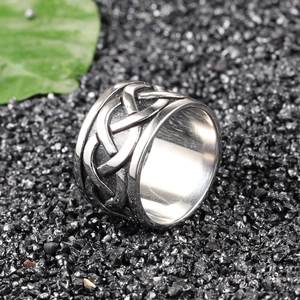Men's vintage stainless steel dragon ring with Celtic knot pattern on black stone background