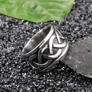 Vintage stainless steel dragon Celtic knot ring for men with oxidized finish on rock