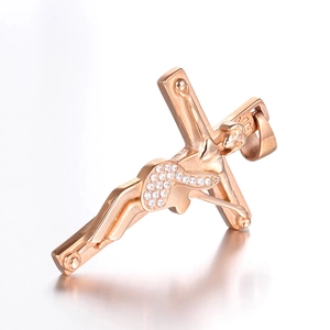 Rose gold crucifix pendant with white zircon inlay and mirror reflection on white base